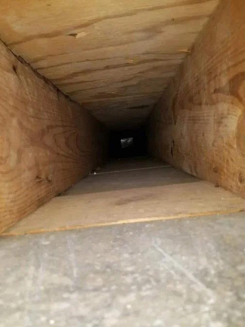 Interior HVAC ductwork with wooden frame and metal ducting installed